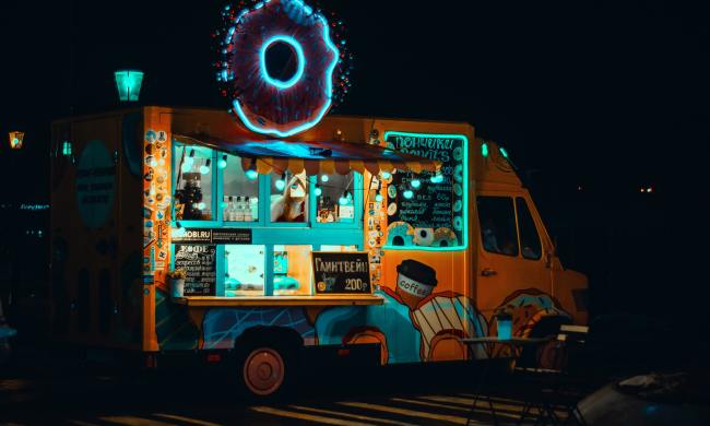 food truck at night overnight parked neon doughnut donut truck