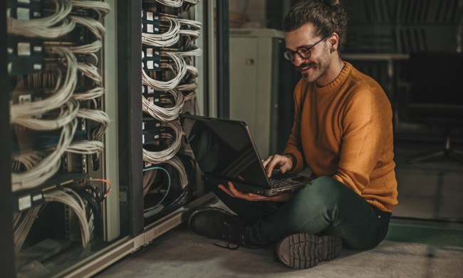 Male Caucasian IT technician in server room